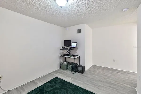 a view of a two chairs in the balcony