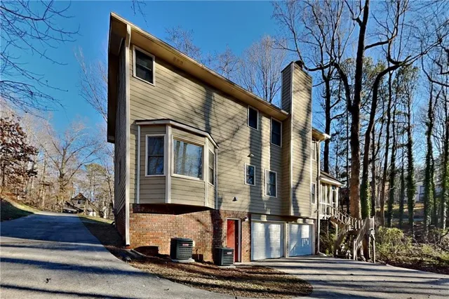 a view of a building with a door and a window