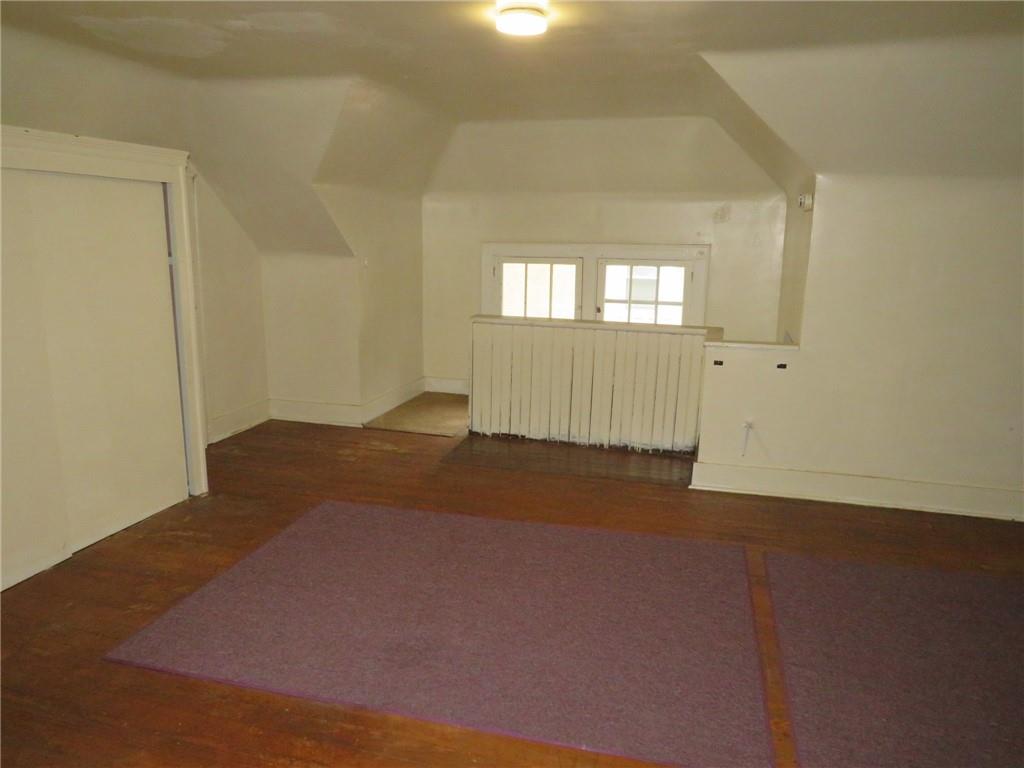 423 Braddock Road Pittsburgh, PA 15221 - Photo 31 of 36 an empty room with wooden floor and windows