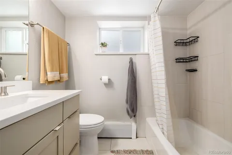 a bathroom with a bathtub and shower