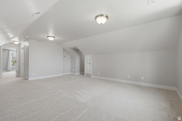1252 Skyline Road Saratoga Springs, UT 84045 - Photo 29 of 51 Expansive carpeted room featuring vaulted ceilings, neutral wall tones, and recessed lighting