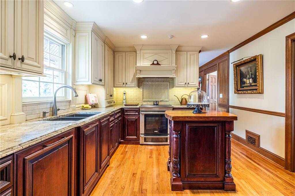 950 Heritage Hills Road Decatur, GA 30033 - Photo 22 of 88 a kitchen with stainless steel appliances granite countertop a stove and a sink