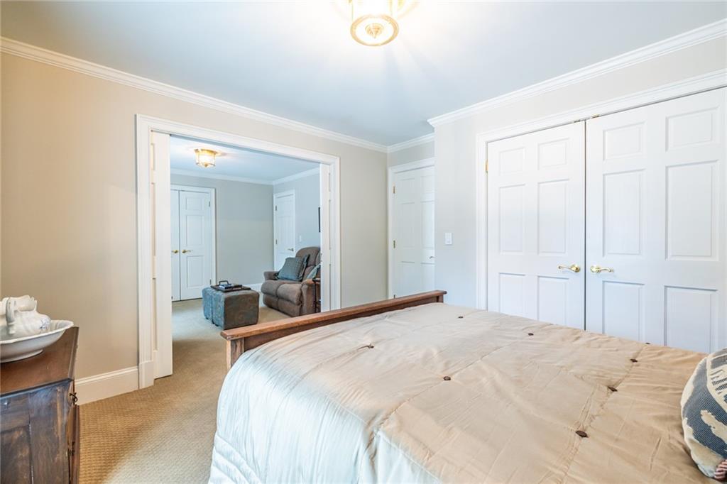 950 Heritage Hills Road Decatur, GA 30033 - Photo 52 of 88 a bedroom with a bed and a lamp