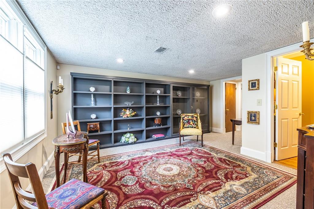 950 Heritage Hills Road Decatur, GA 30033 - Photo 59 of 88 a living room with furniture and a rug