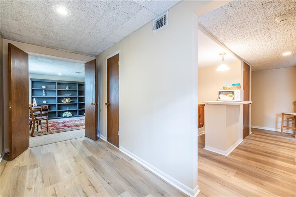 950 Heritage Hills Road Decatur, GA 30033 - Photo 62 of 88 a view of a hallway view with wooden floor and dining room