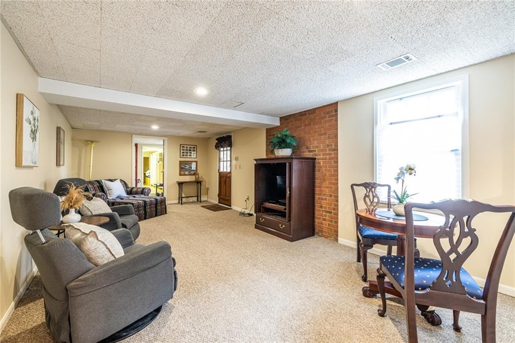 950 Heritage Hills Road Decatur, GA 30033 - Photo 65 of 88 a living room with furniture and a flat screen tv