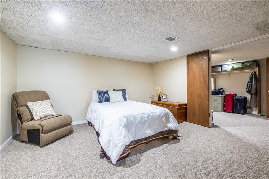 950 Heritage Hills Road Decatur, GA 30033 - Photo 67 of 88 a bed room with a bed and a chair