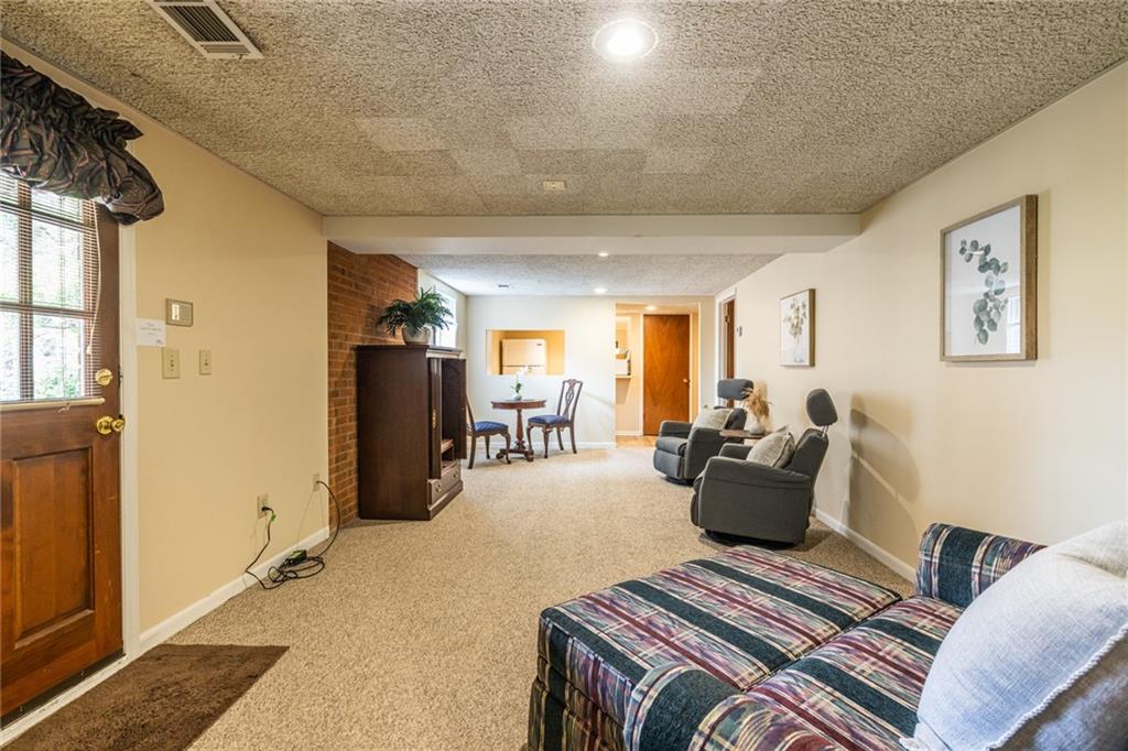950 Heritage Hills Road Decatur, GA 30033 - Photo 76 of 88 a living room with furniture a couch and large window