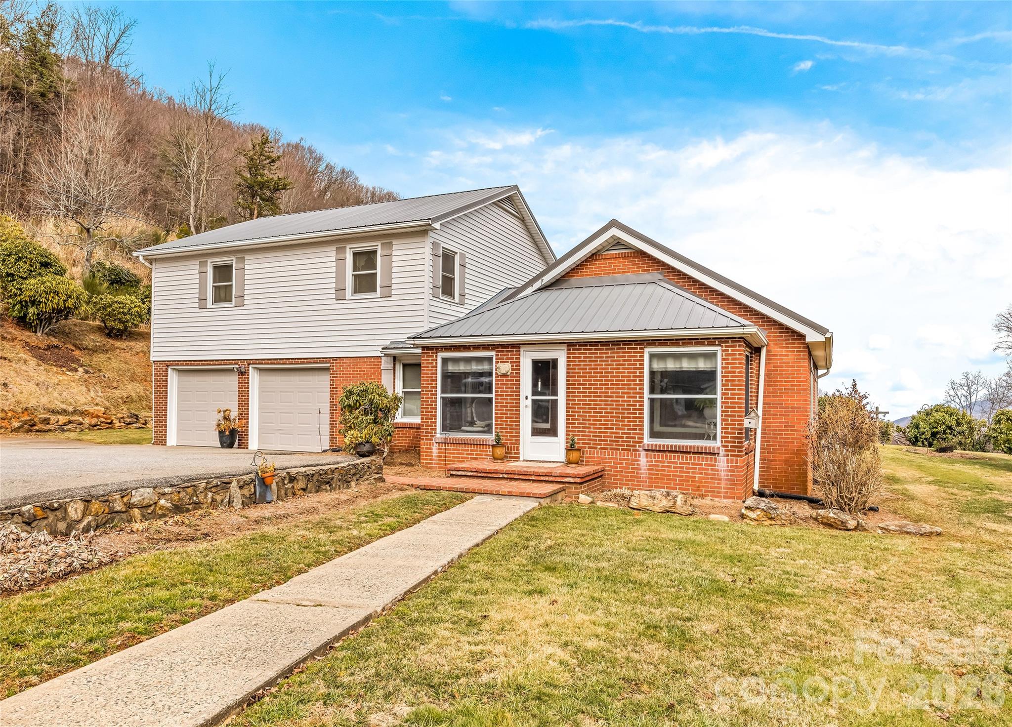 15 Whitted Road Canton, NC 28716 - Photo 1 of 38 a front view of a house with a yard