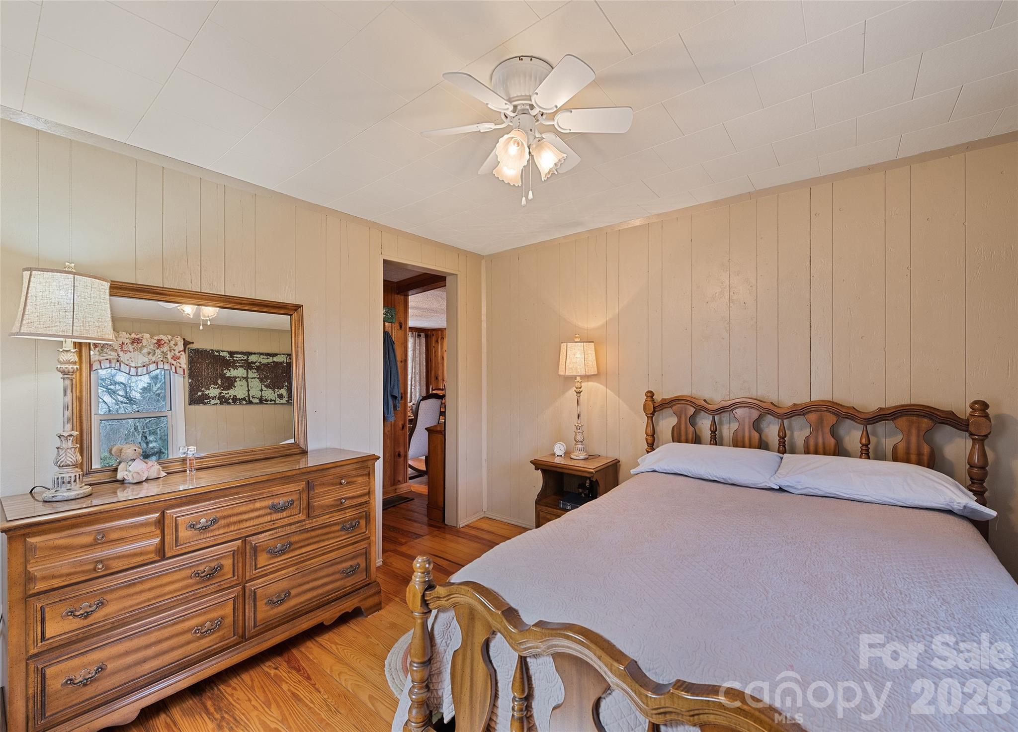 15 Whitted Road Canton, NC 28716 - Photo 19 of 38 a bedroom with a bed and a large mirror on the dresser