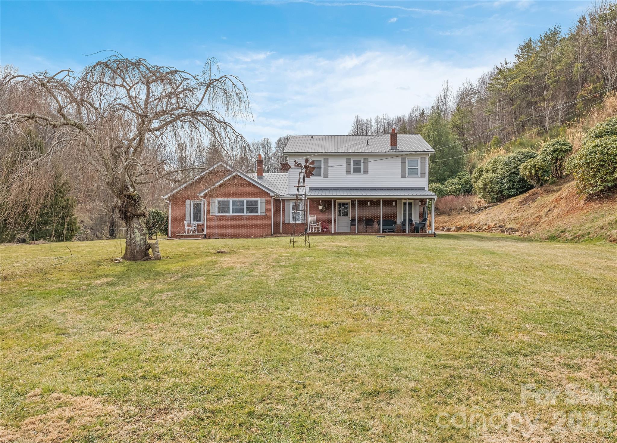 15 Whitted Road Canton, NC 28716 - Photo 2 of 38 a front view of house with yard and lake view