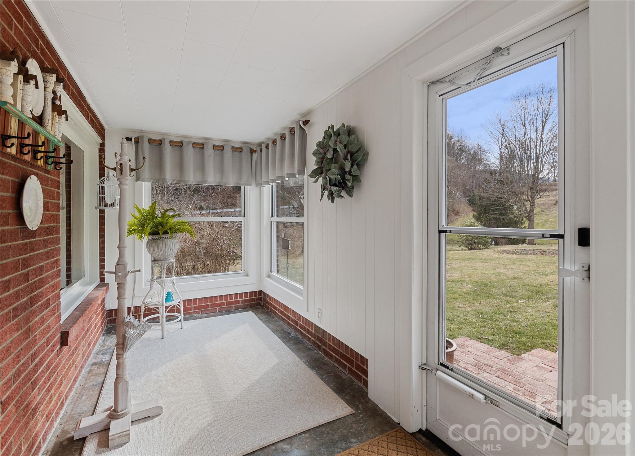 15 Whitted Road Canton, NC 28716 - Photo 4 of 38 a view of room with window and hardwood floor