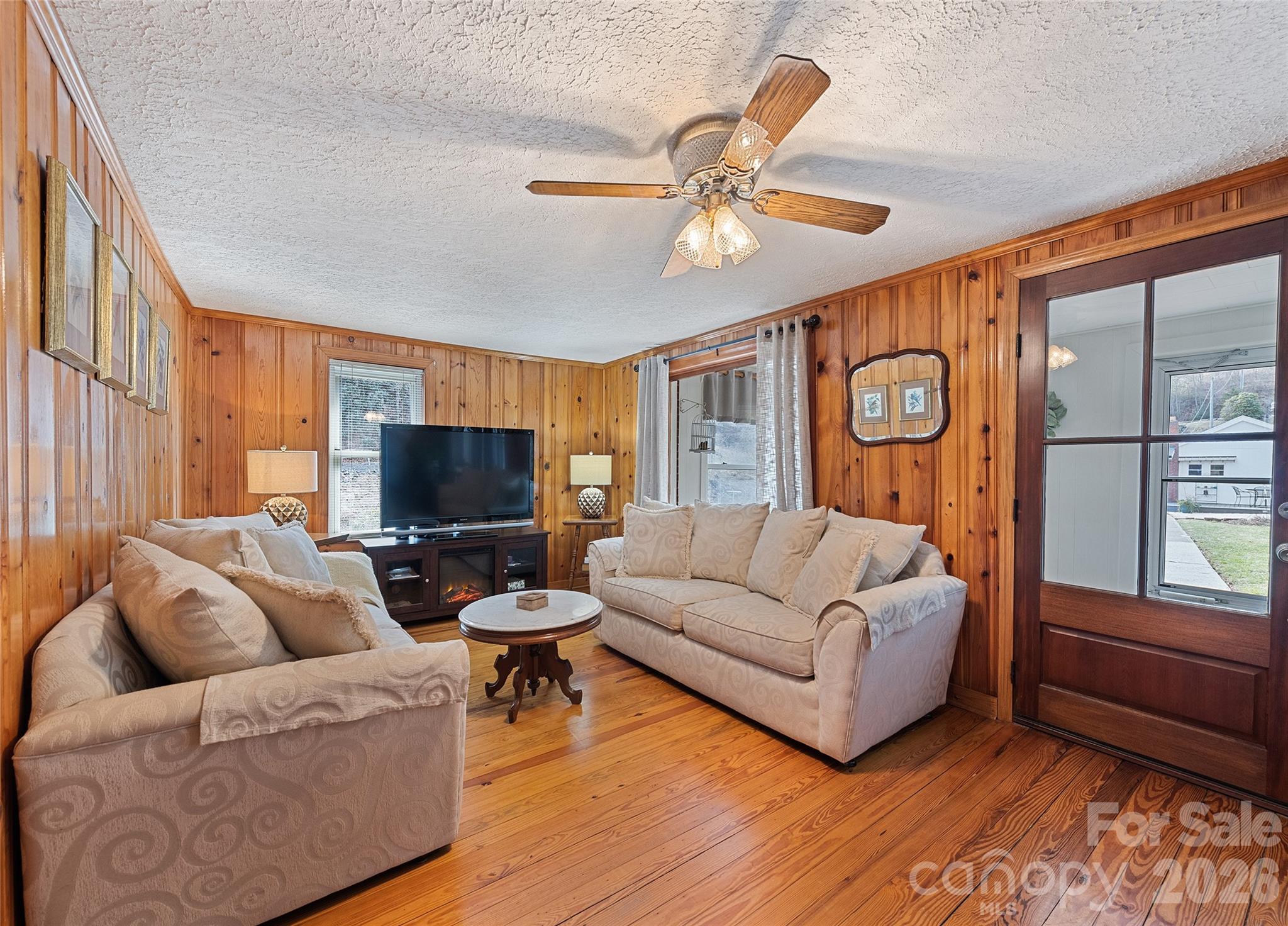 15 Whitted Road Canton, NC 28716 - Photo 6 of 38 a living room with furniture and a flat screen tv