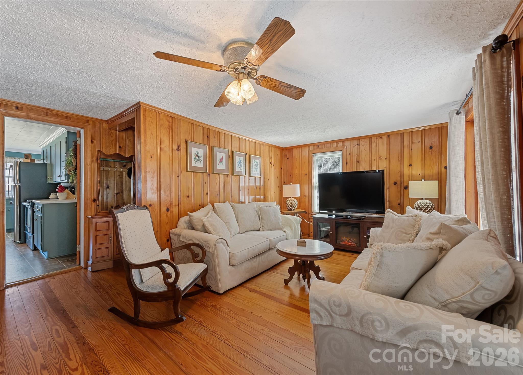 15 Whitted Road Canton, NC 28716 - Photo 7 of 38 a living room with furniture and a flat screen tv