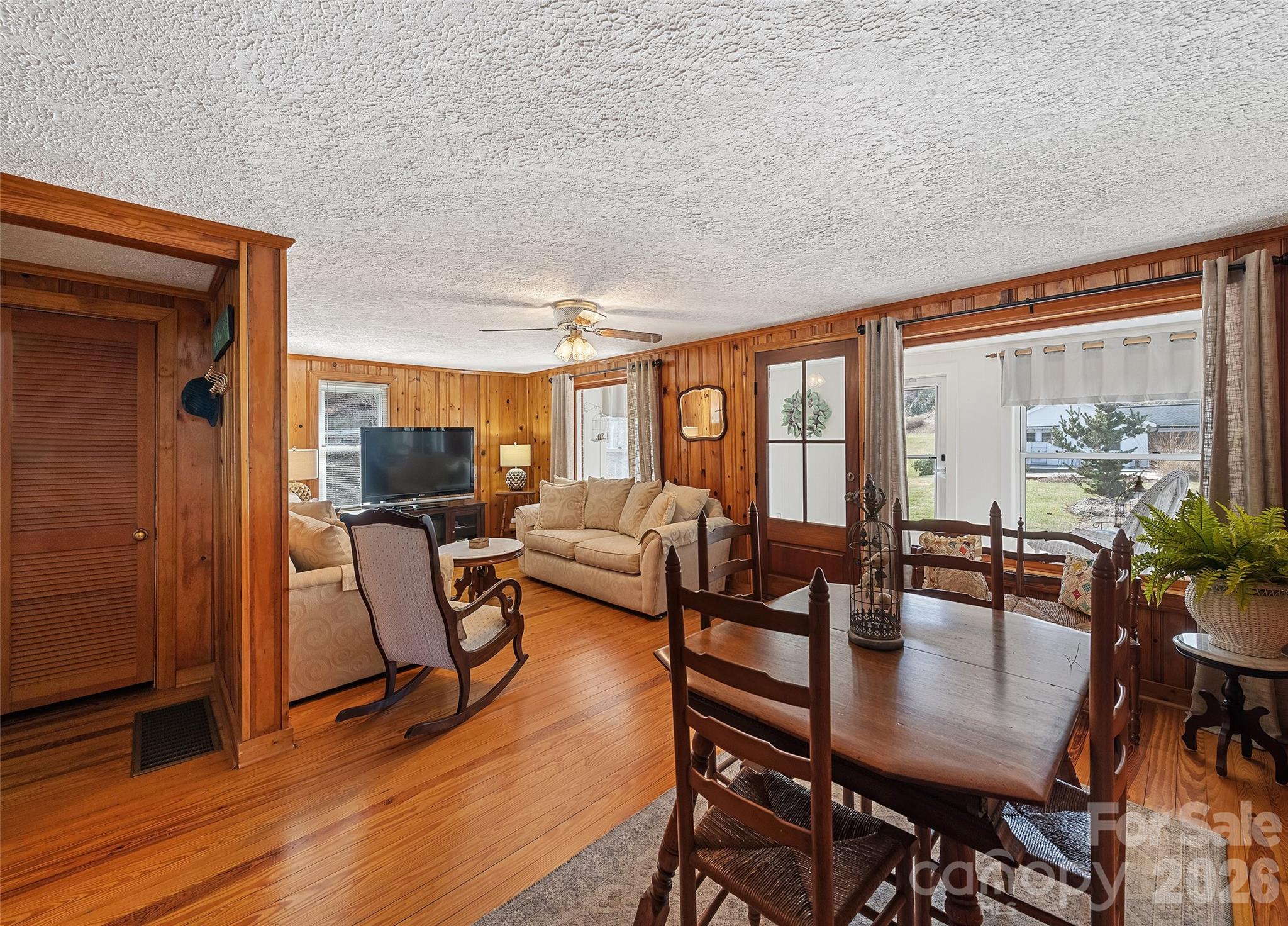 15 Whitted Road Canton, NC 28716 - Photo 9 of 38 a view of a dining room with furniture window and wooden floor