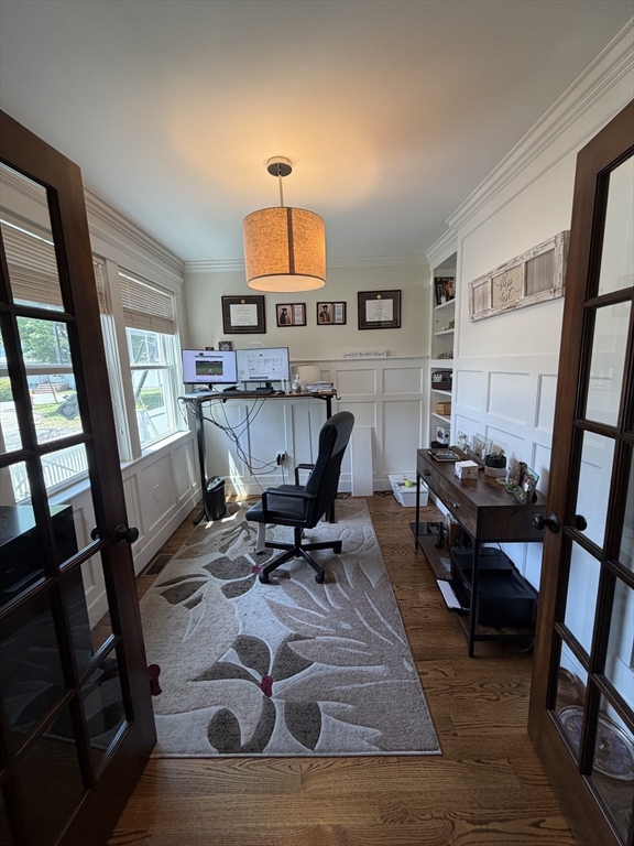 17 Cardinal Street, Unit 17 Winchester, MA 01890 - Photo 2 of 42 a living room with furniture and a wooden floor