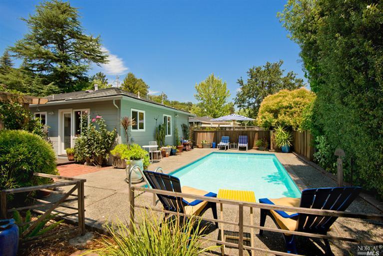 54 Butterfield Road San Anselmo, CA 94960 - Photo 1 of 1 a view of a patio with table and chairs potted plants and large tree