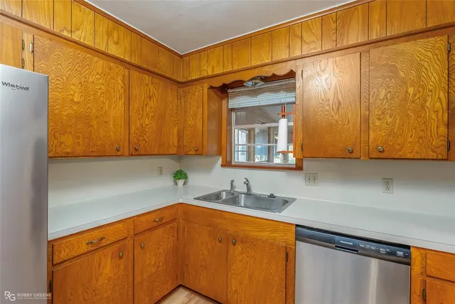 a kitchen with a sink and cabinets
