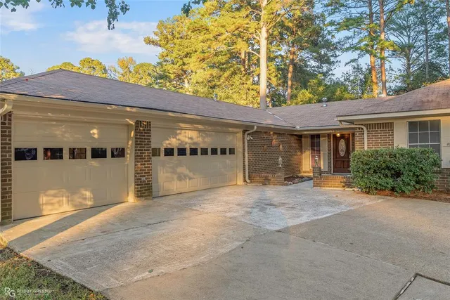 front view of a house with a large window