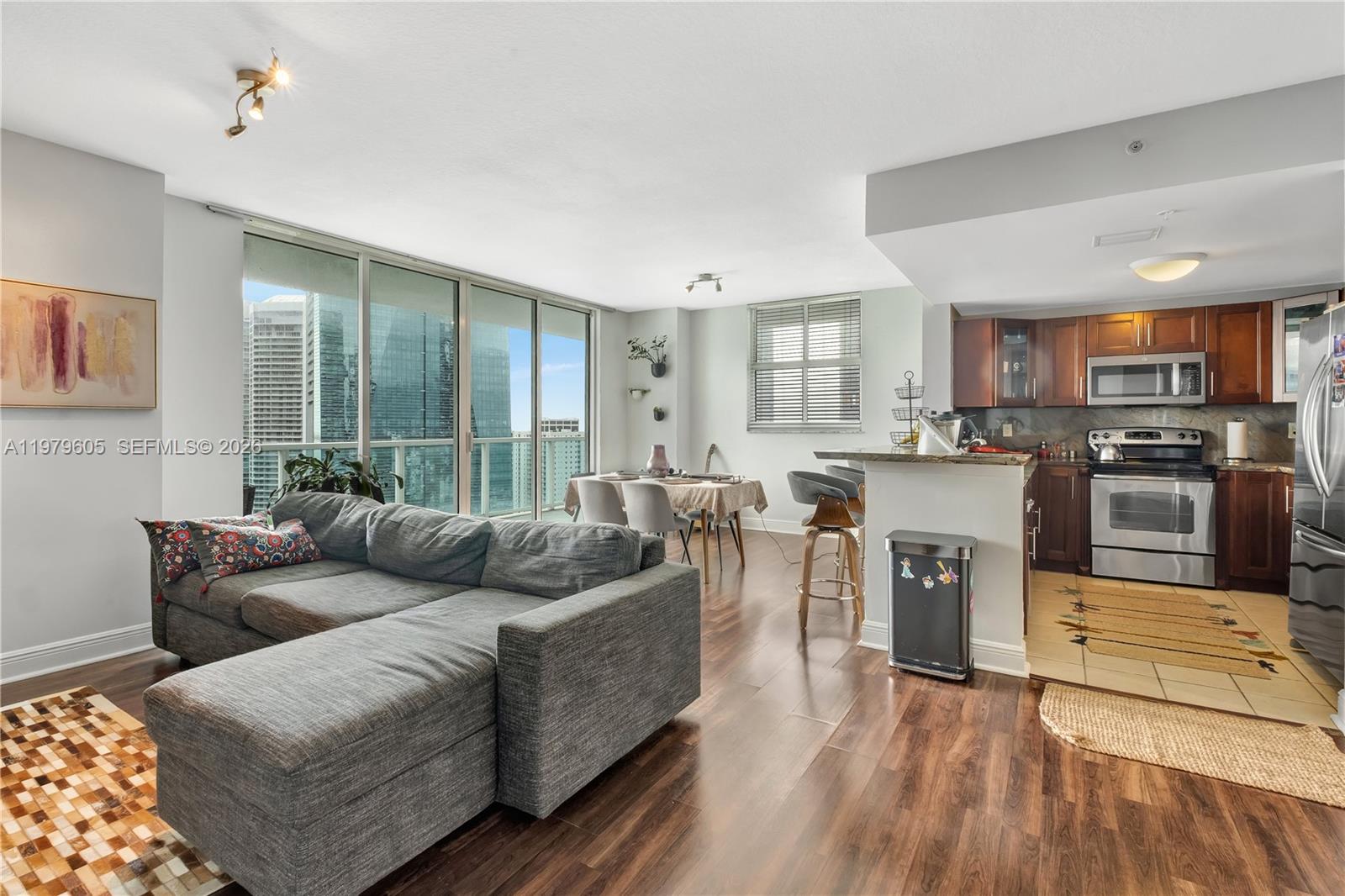1250 South Miami Avenue, Unit 2802 Miami, FL 33130 - Photo 1 of 64 a living room with furniture and a wooden floor