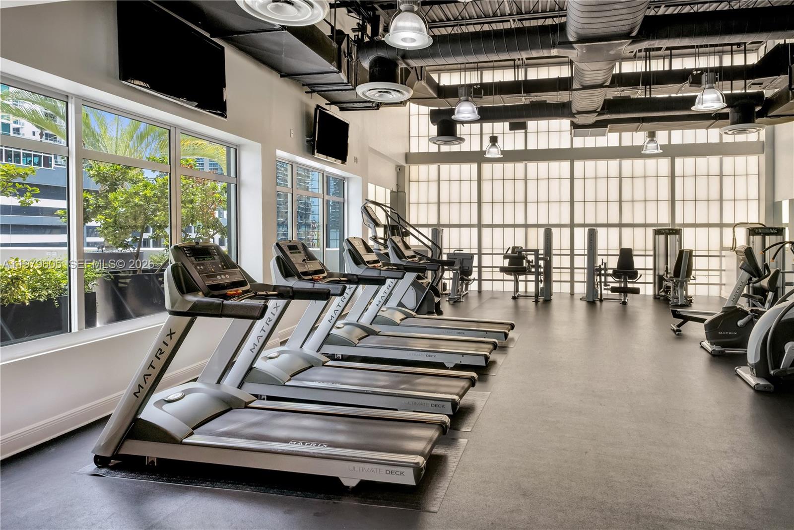 1250 South Miami Avenue, Unit 2802 Miami, FL 33130 - Photo 33 of 64 a view of a gym with large windows