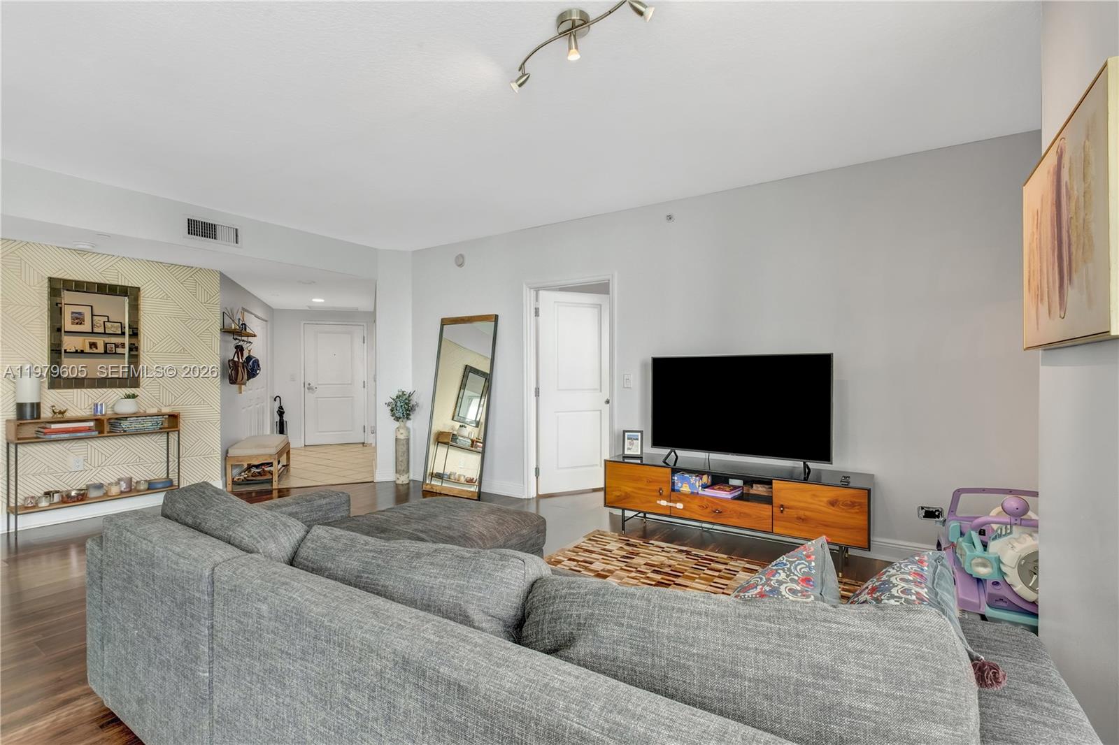 1250 South Miami Avenue, Unit 2802 Miami, FL 33130 - Photo 45 of 64 a living room with furniture and a flat screen tv
