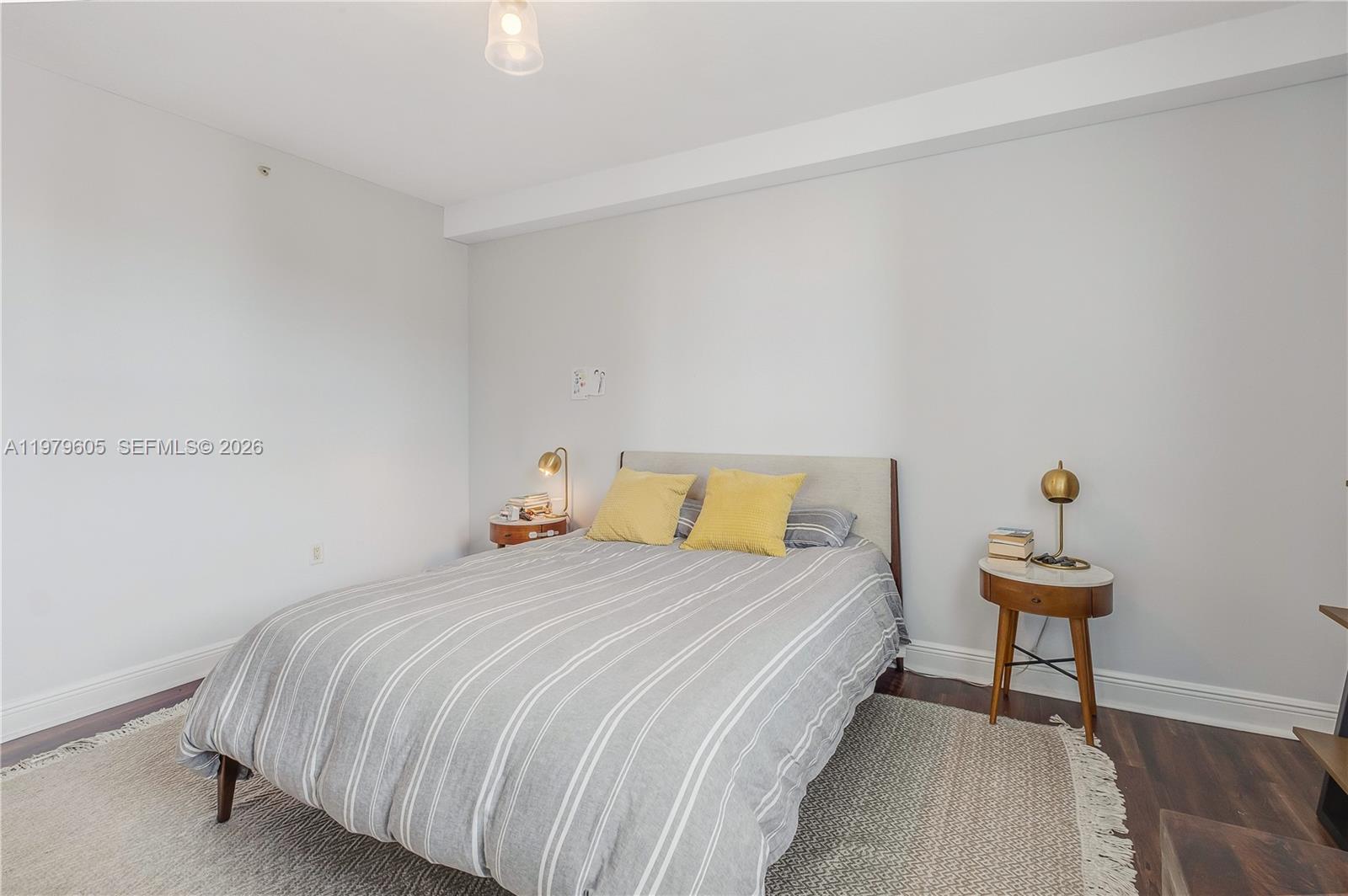 1250 South Miami Avenue, Unit 2802 Miami, FL 33130 - Photo 48 of 64 a bedroom with a bed and a chair