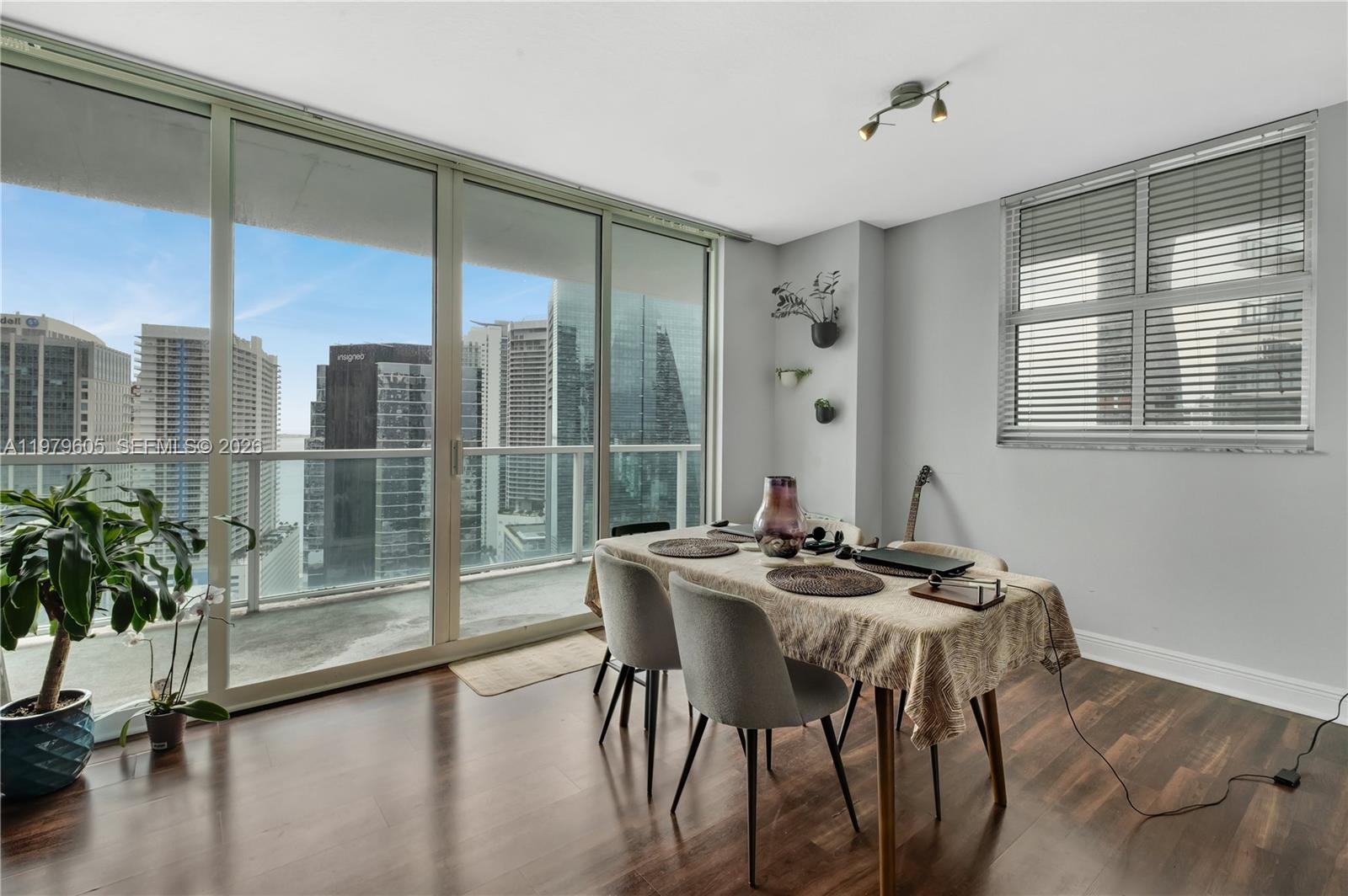 1250 South Miami Avenue, Unit 2802 Miami, FL 33130 - Photo 59 of 64 a view of a dining room with furniture window and wooden floor