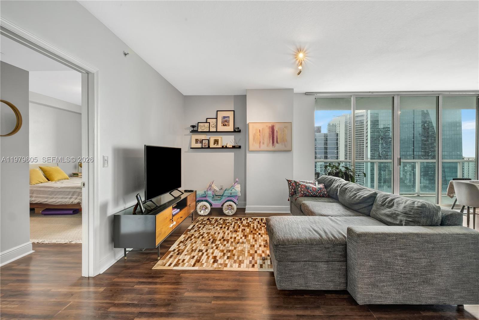 1250 South Miami Avenue, Unit 2802 Miami, FL 33130 - Photo 61 of 64 a living room with furniture and a flat screen tv