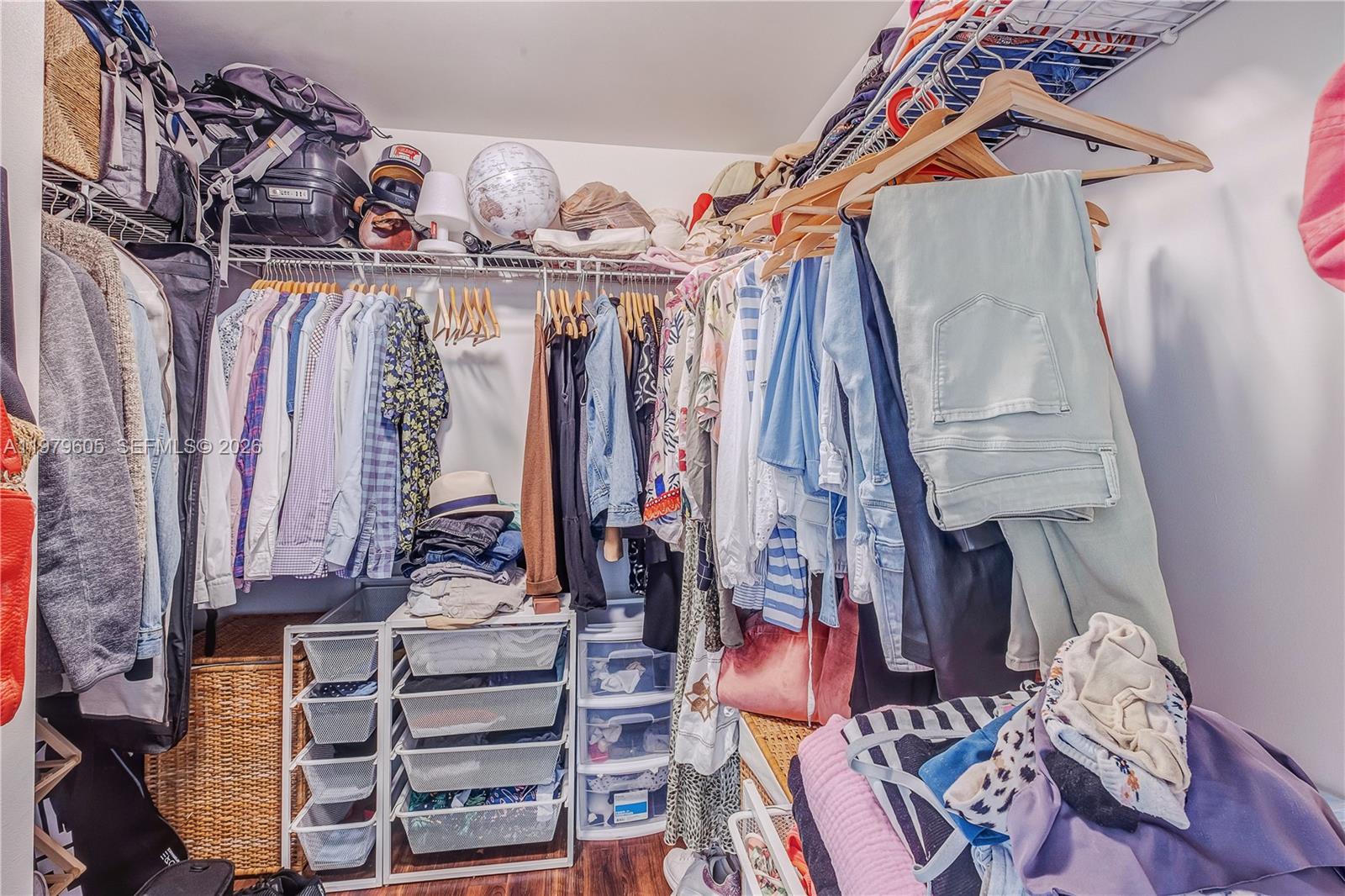 1250 South Miami Avenue, Unit 2802 Miami, FL 33130 - Photo 62 of 64 a view of walk in closet with clothes