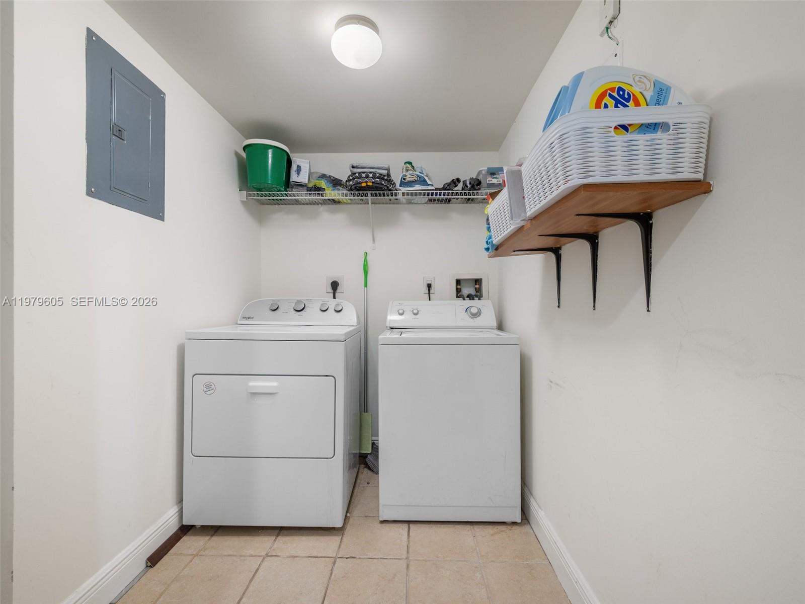 1250 South Miami Avenue, Unit 2802 Miami, FL 33130 - Photo 64 of 64 a utility room with dryer washer and a view of living room
