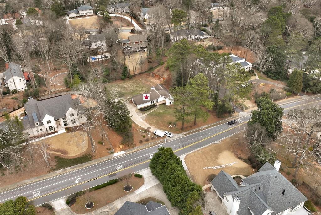 905 Heards Ferry Road Northwest Atlanta, GA 30328 - Photo 1 of 1 an aerial view of residential houses with outdoor space
