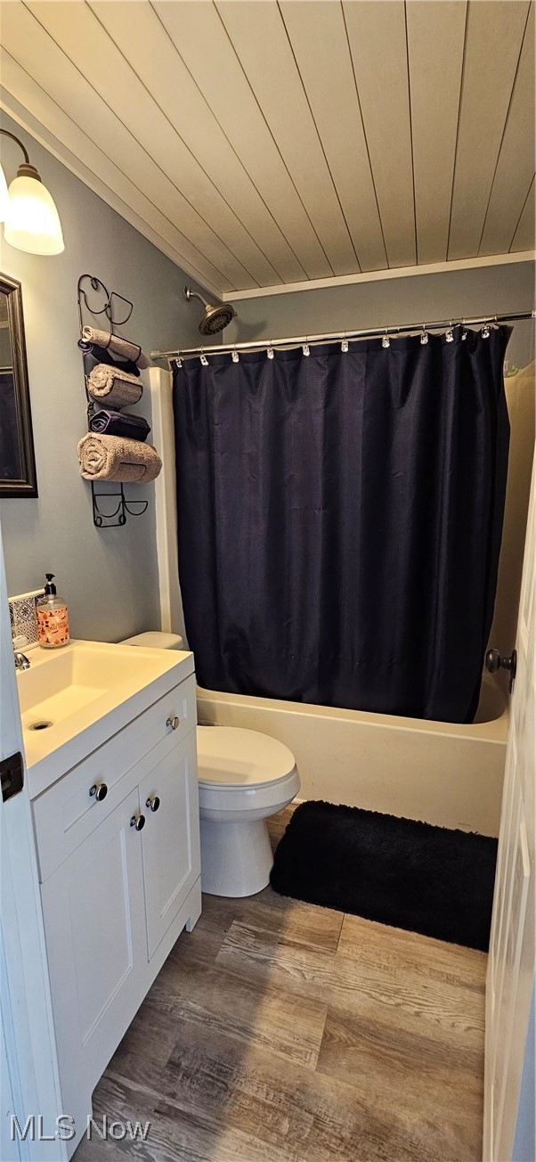 52 Salt Street Rittman, OH 44270 - Photo 21 of 34 Bathroom with vanity, shower / bath combo, wood finished floors, and wooden ceiling