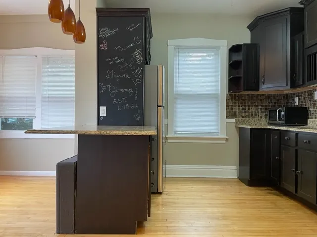 a view of a bathroom with a sink and a mirror