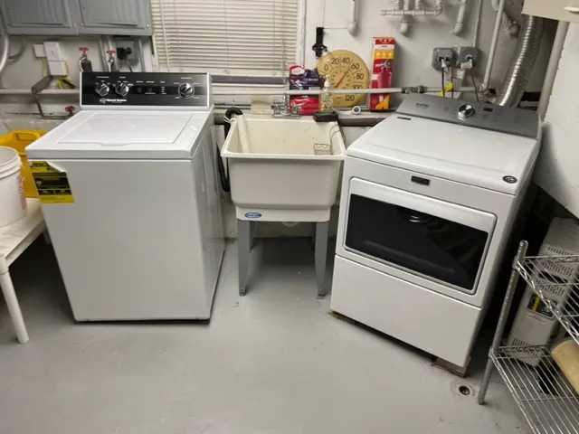 a utility room with dryer and washer