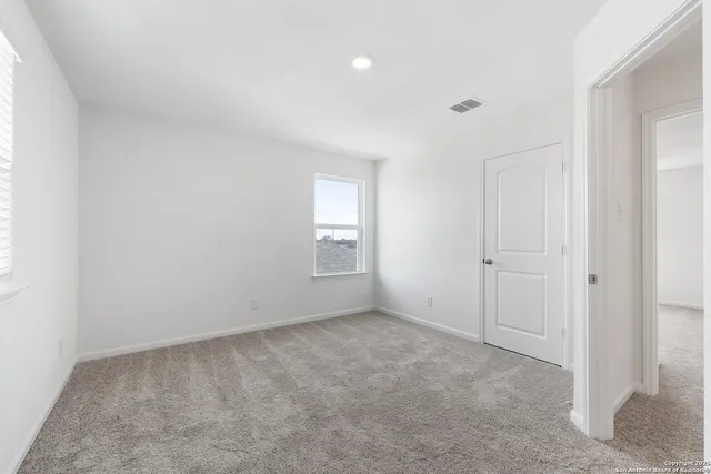 a view of an empty room and window