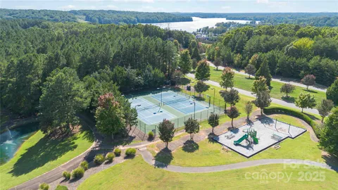 a view of a swimming pool with a yard