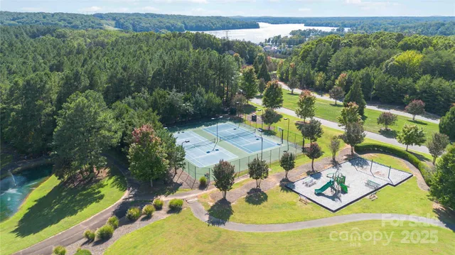 a view of a swimming pool with a yard