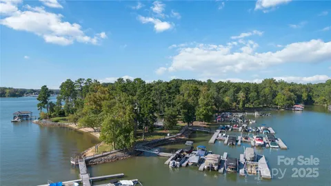 a view of a lake with outdoor seating