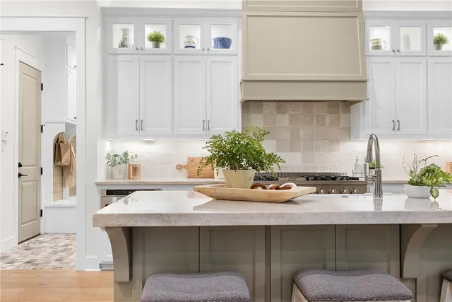 a kitchen with a sink and cabinets
