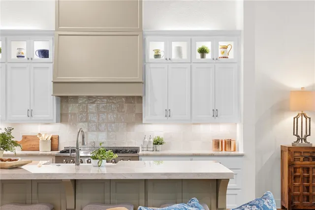 a kitchen with stainless steel appliances granite countertop a sink and a stove