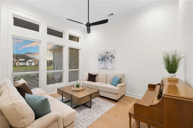a living room with furniture and a large window
