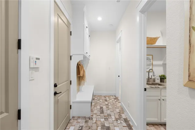a bathroom with a sink and mirror