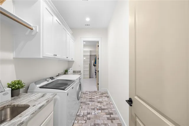 a kitchen that has a sink and a stove in it