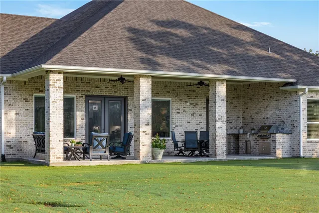 a view of a water fountain in the patio with a backyard