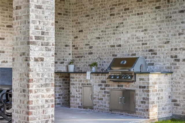 a brick oven with a stove top oven