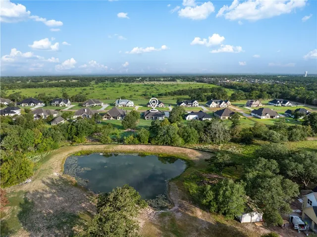 a view of a lake with a yard