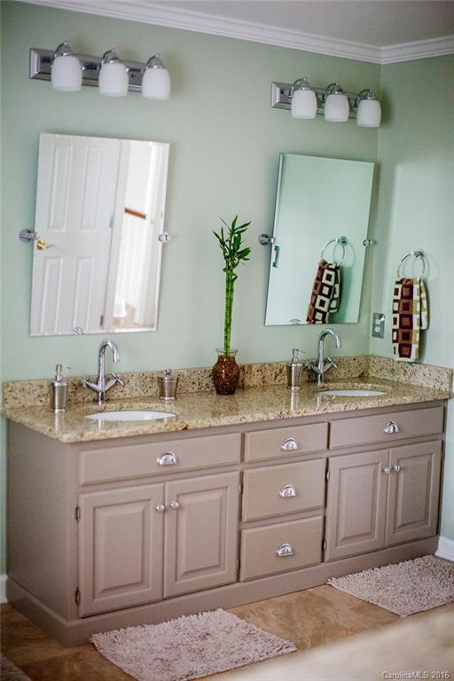 12521 Hawks Ridge Road Huntersville, NC 28078 - Photo 14 of 24 a bathroom with a granite countertop sink and a mirror