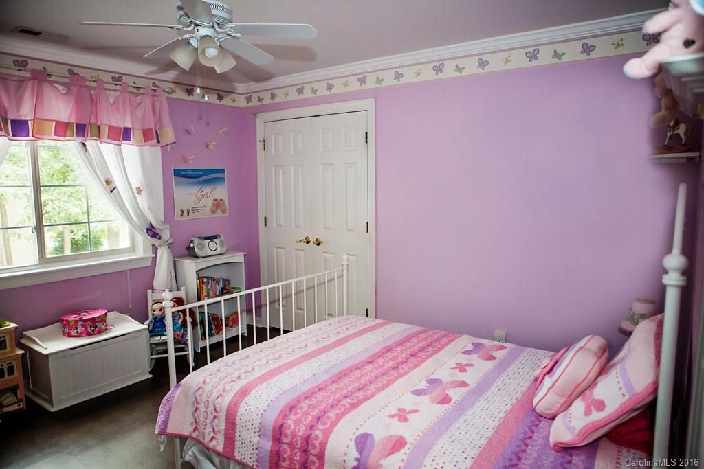 12521 Hawks Ridge Road Huntersville, NC 28078 - Photo 19 of 24 a bedroom with a bed and a window