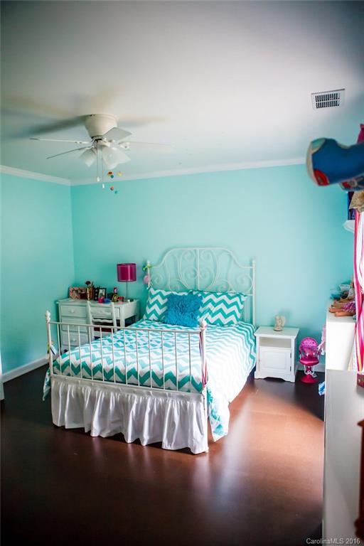 12521 Hawks Ridge Road Huntersville, NC 28078 - Photo 21 of 24 a bedroom with furniture and a chandelier